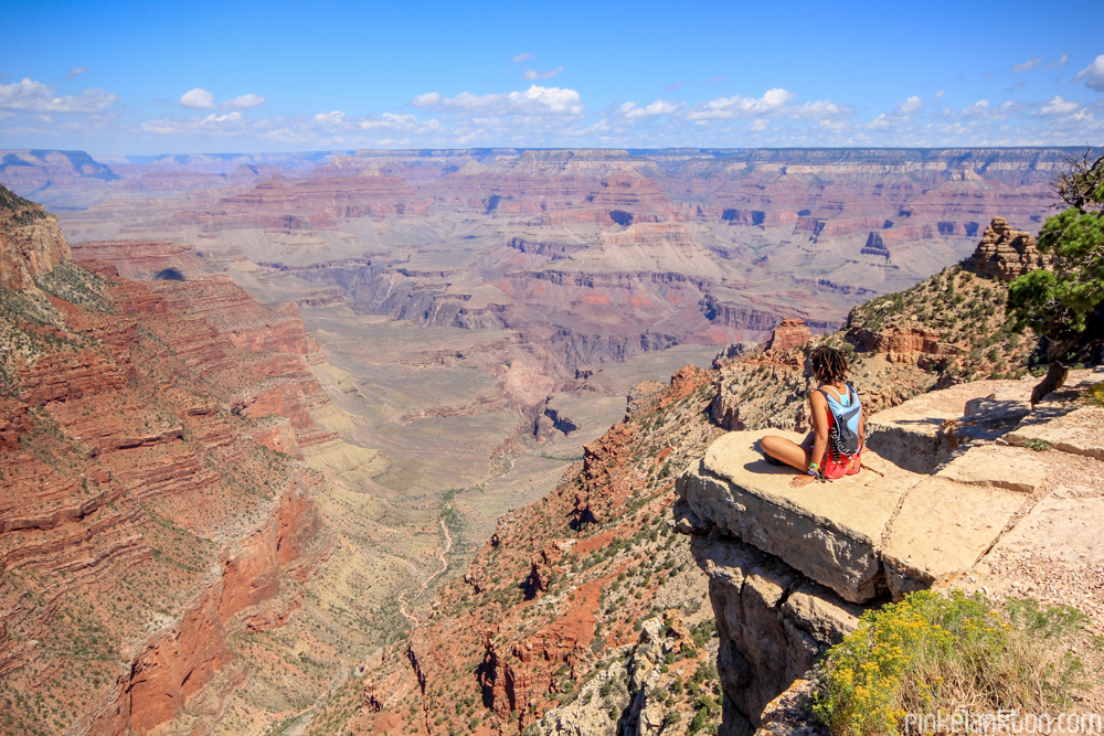 Girl sitting on edge of the Grand Canyon in Arizona
