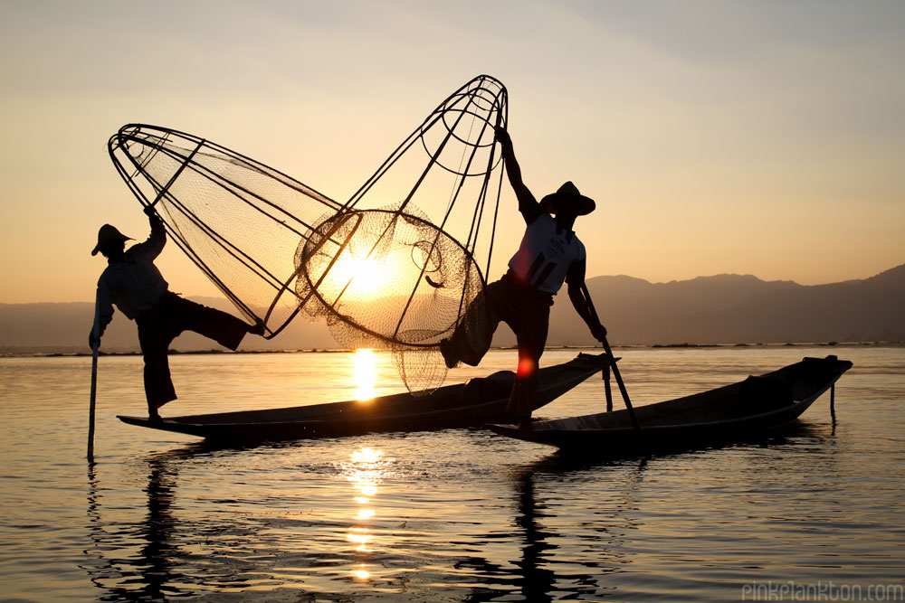 fisherman posing at sunset on Inle Lake