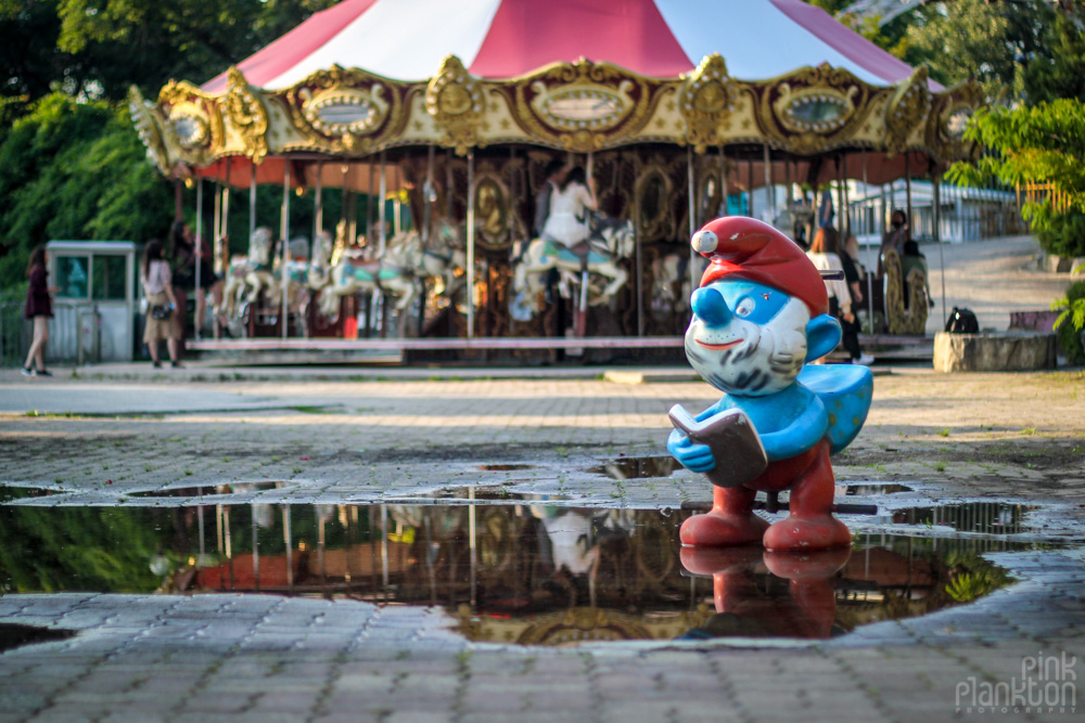abandoned merry go round and smurf statue at Yongma Land in Seoul