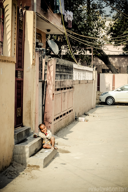 a residential street in New Delhi with child