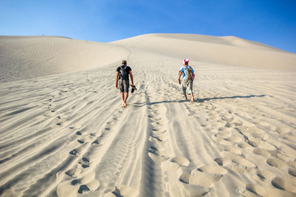 hiking up sand dunes