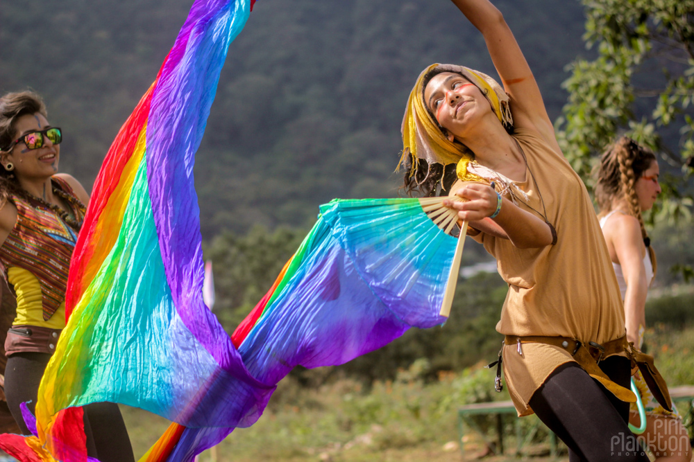 girl waving rainbow flags