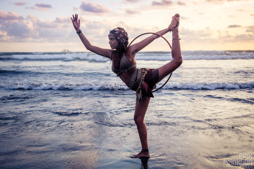 Envision Festival hooper girl on beach at sunset