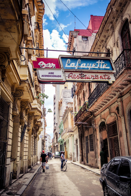 Havana, Cuba grungy street with old neon sign