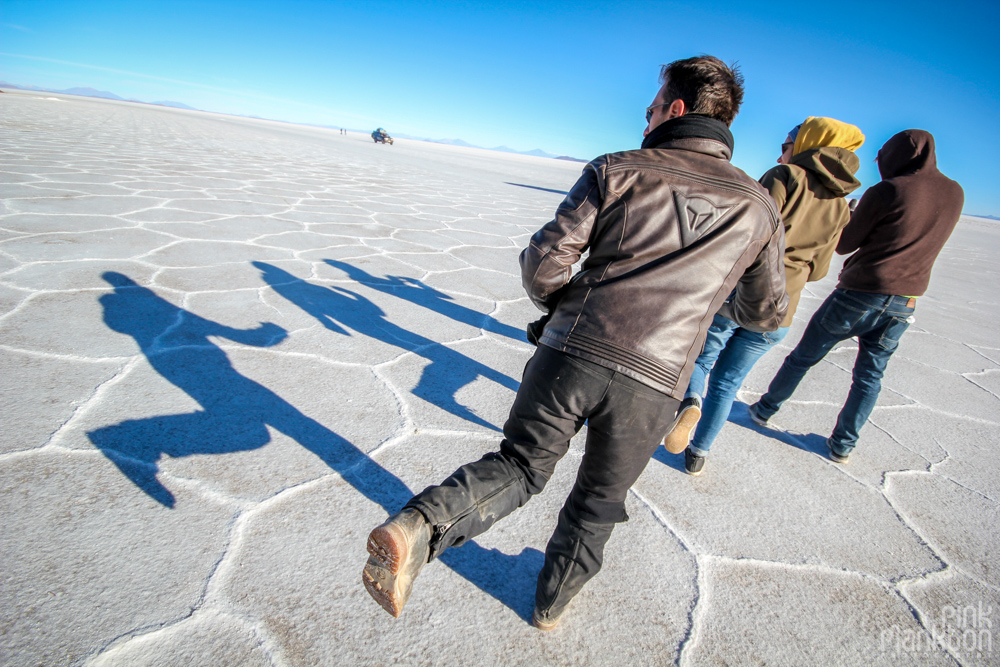 people and their shadows on Bolivia’s Salar de Uyuni