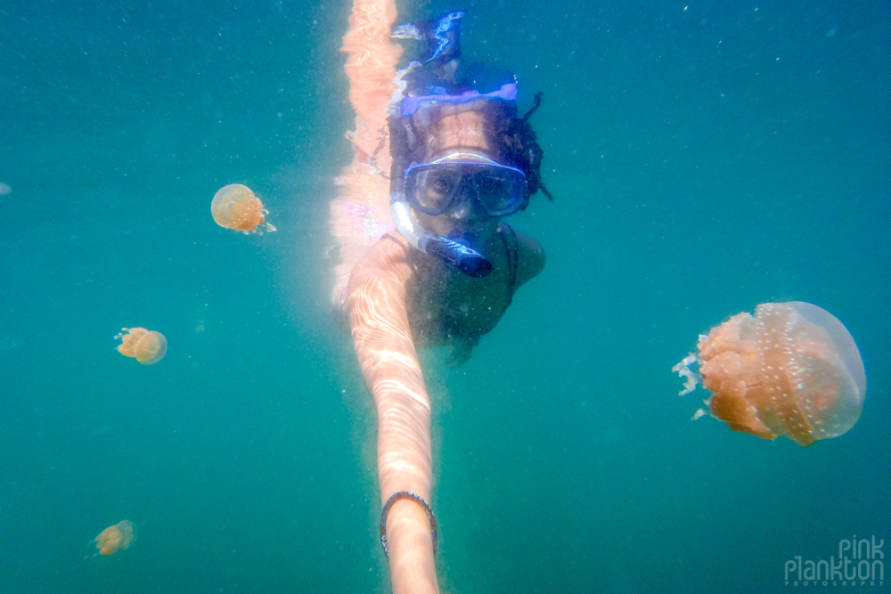 girl snorkeling in jellyfish lake in Togean Islands, Sulawesi, Indonesia