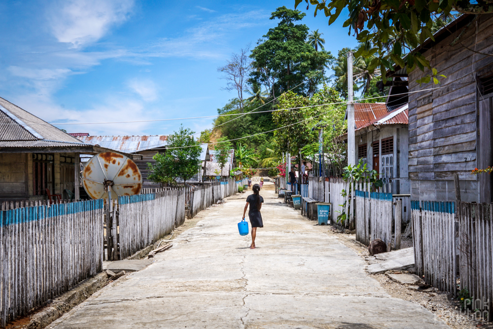 girl walking in Katupat village, Togean Islands