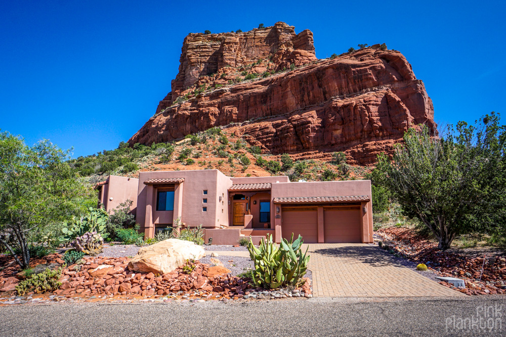 House in Sedona with red rocks in backyard