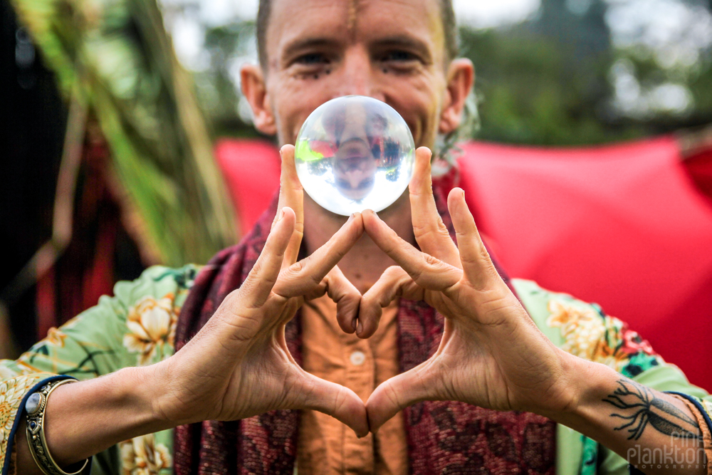 Man with contact juggling ball at Cosmic Convergence Festival