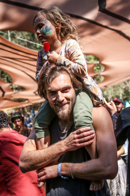 father and child on shoulder at Festival Psycristrance
