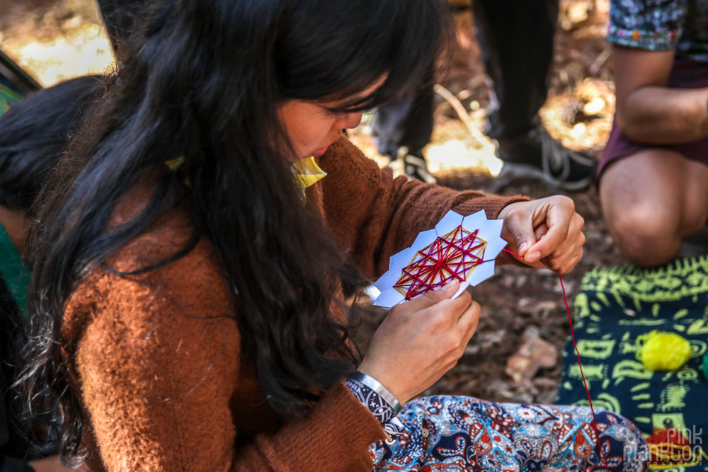 woman making string art at Festival Psycristrance
