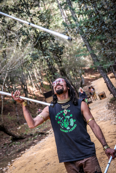 man juggling poles at Festival Psycristrance