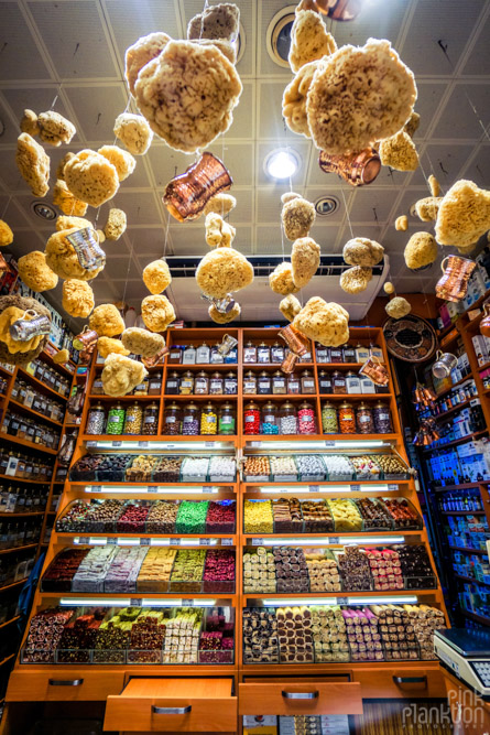 sponged hanging from the ceiling and Turkish delight inside a store at Istanbul's Spice Bazaar