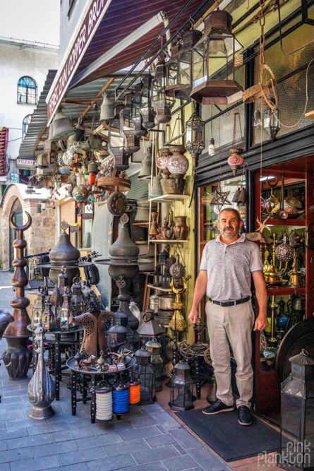 Store keeper in front of his antique store in Istanbul's Grand Bazaar