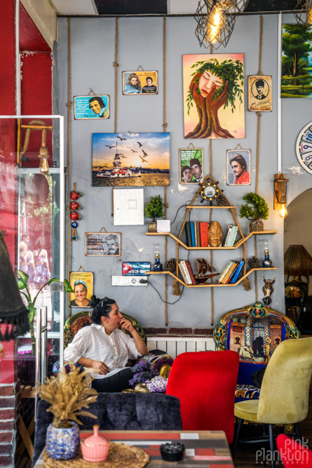 Coffee shop with art and person sitting in Balat, Istanbul