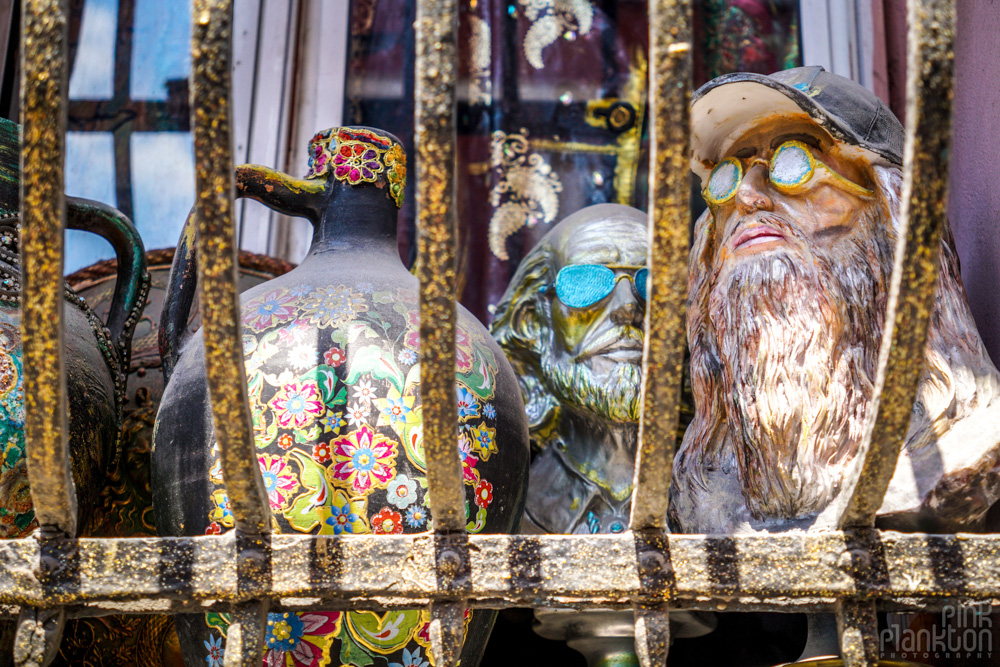 face sculptures in a window sill in Balat, Istanbul