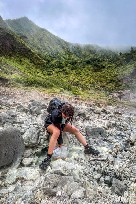 Girl boiling eggs in the Valley of Desolation along the Boiling Lake Hike in Dominica