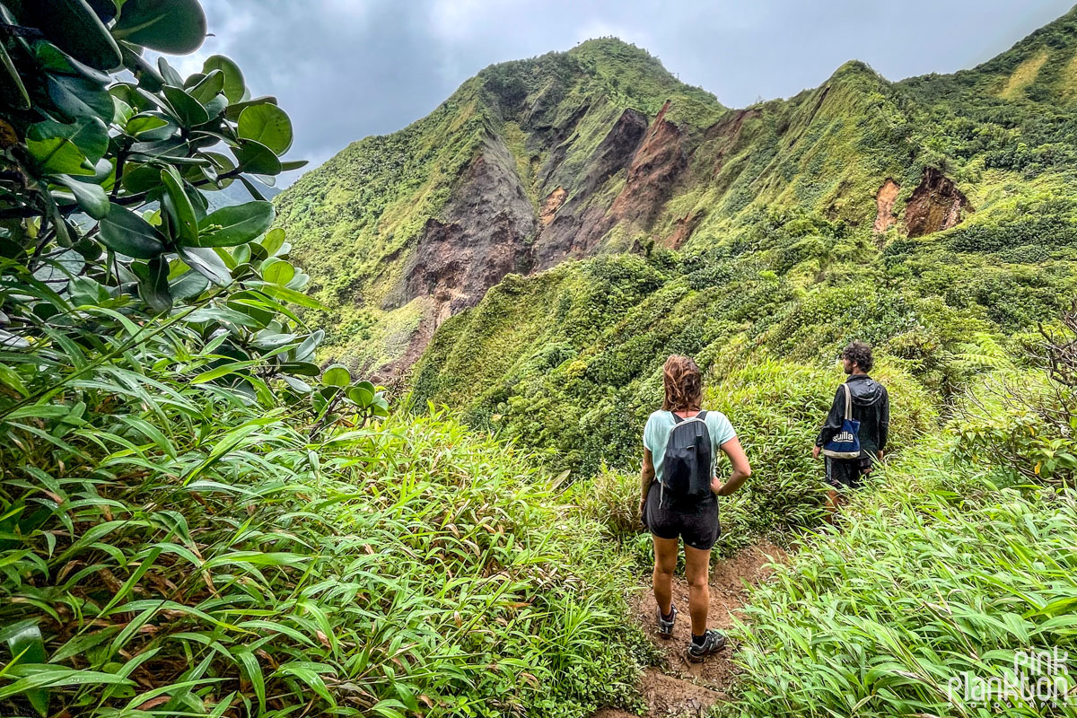 Hikers with mountain scenery along the Boiling Lake Hike in Dominica