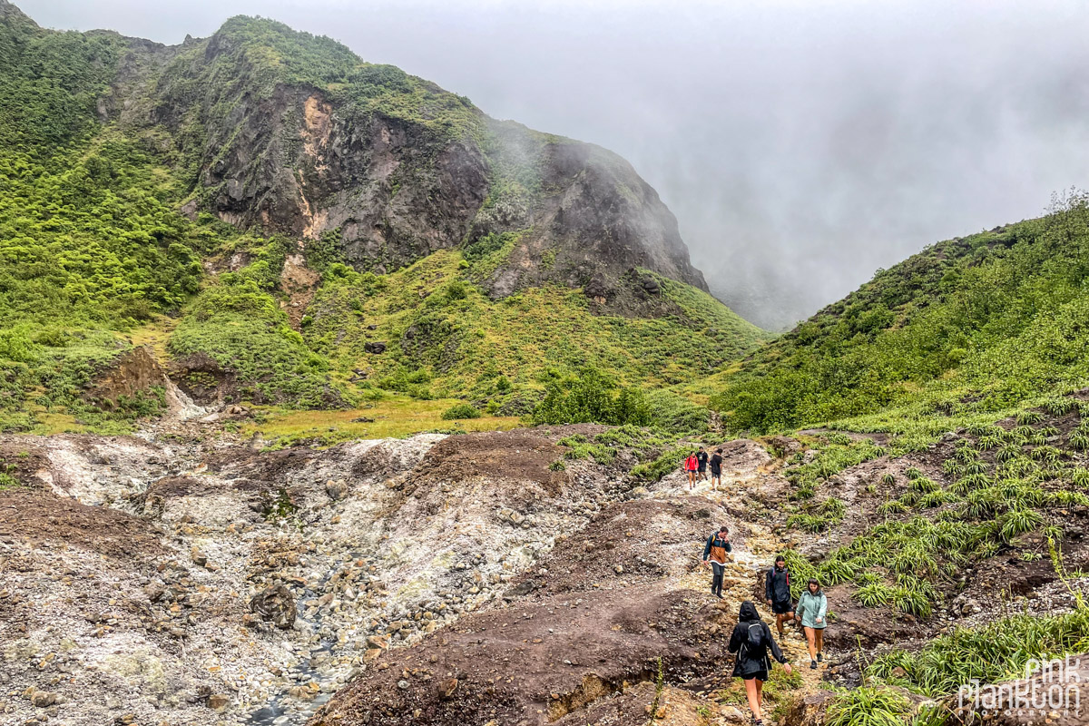 Hikers along the mountain scenery of the Boiling Lake Hike in Dominica