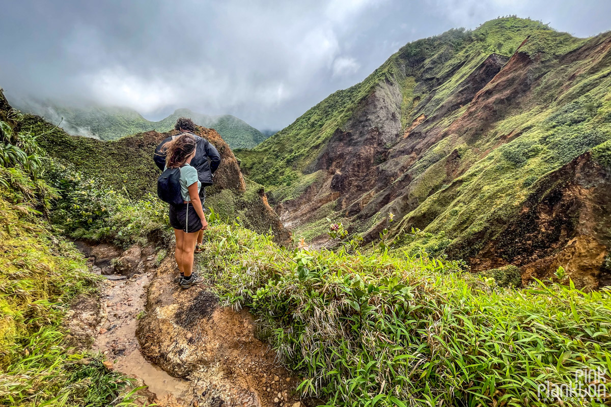 Hikers with mountain scenery along the Boiling Lake Hike in Dominica