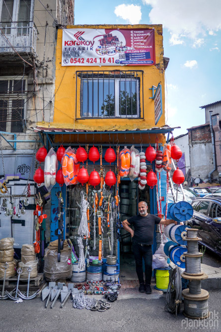 Shop keeper standing outside his marine equipment store in Karakoy, Istanbul