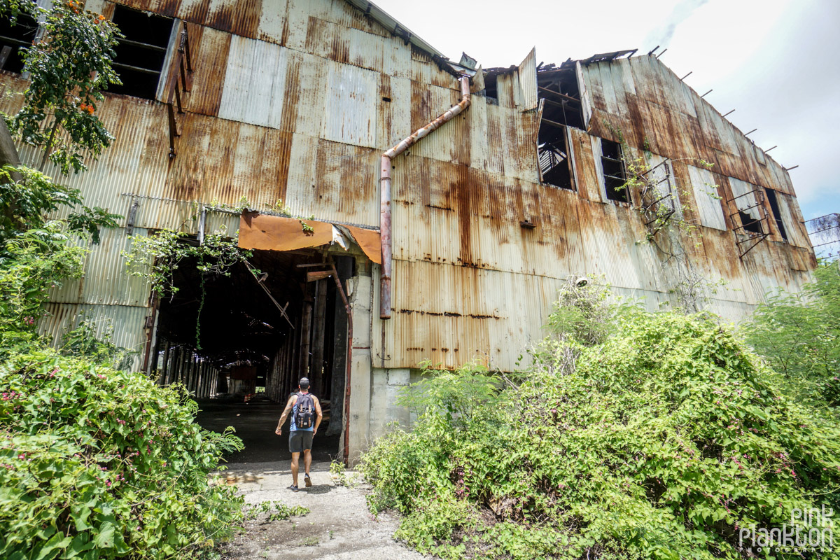 Male walking into an abandoned sugar mill in Guanica Puerto Rico