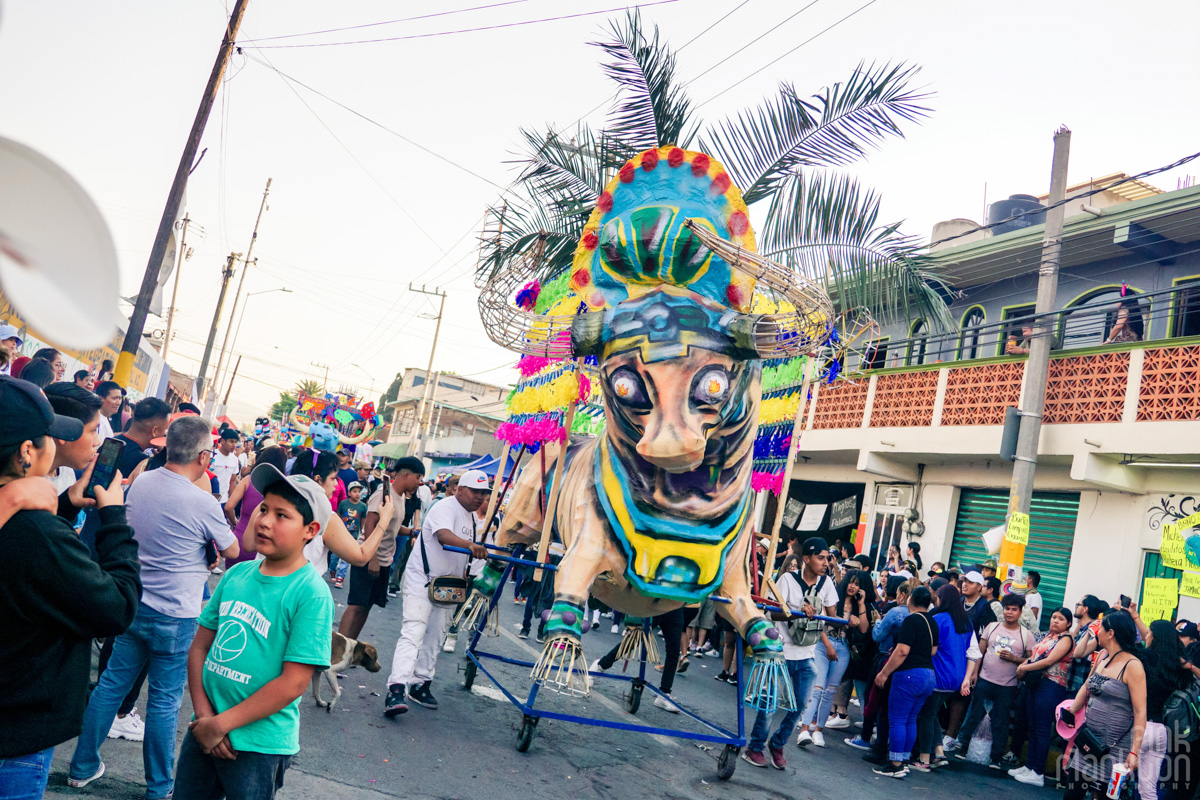 Aztev-style bull in Mexico's Bulls of Fire Festival parade in daytime