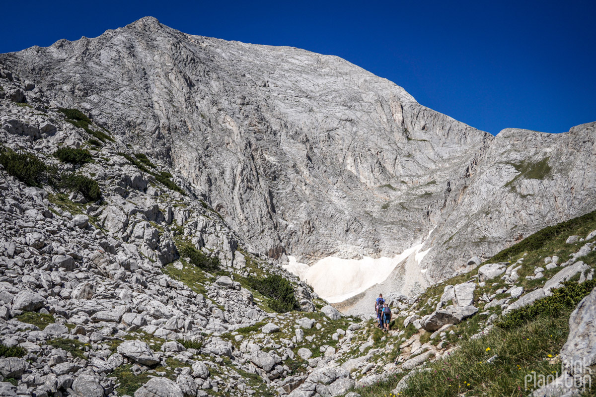 View of mountains with hikers on trail to Koncheto Ridge in Bulgaria