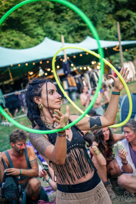 Girl dancing with hula hoops at Modem Festival