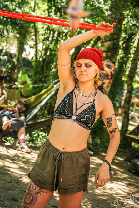 Girl spinning hula hoop at modem festival