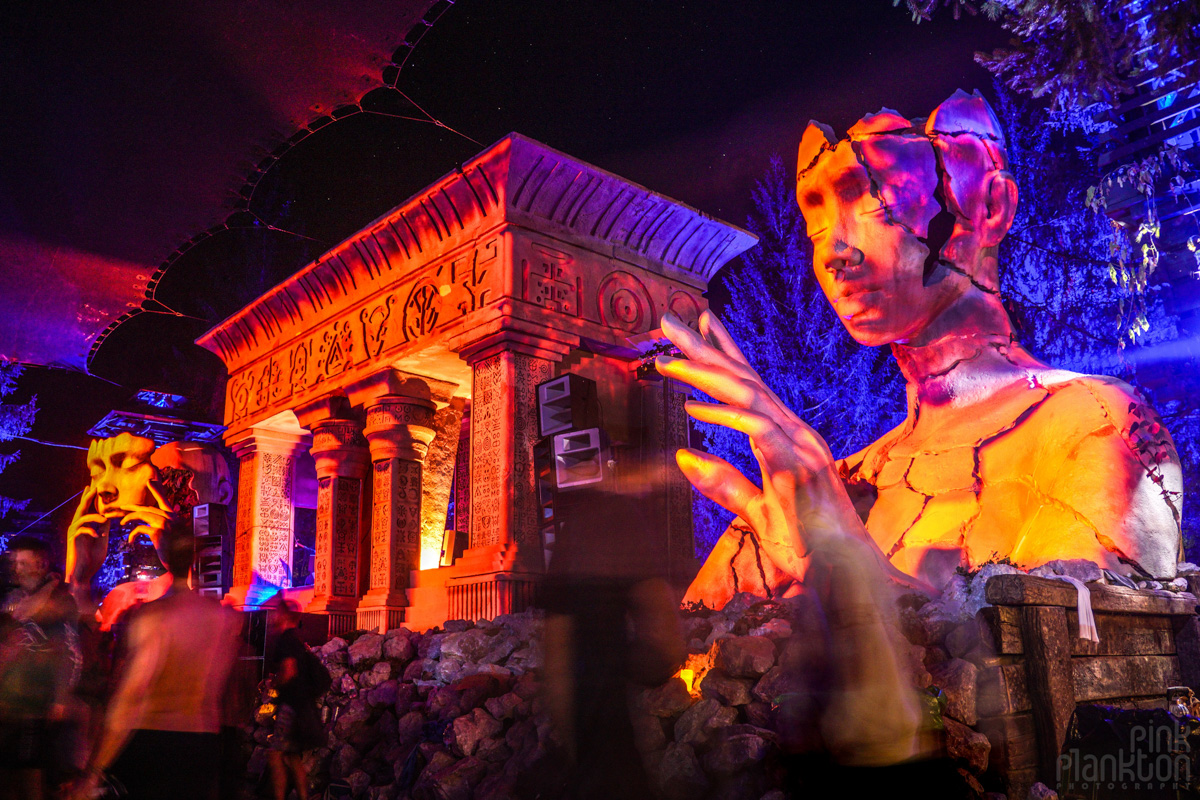 Face sculptures and temple by Daniel Popper at the Swamp Stage at Modem Festival at night