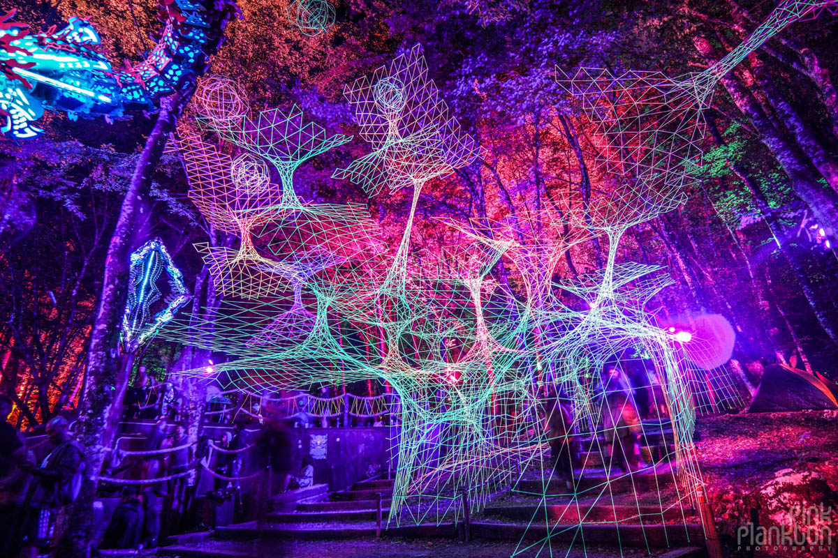 The Hive Stage black light string art at night at Modem Festival