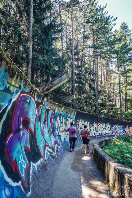 People walking on abandoned bobsled track in Sarajevo